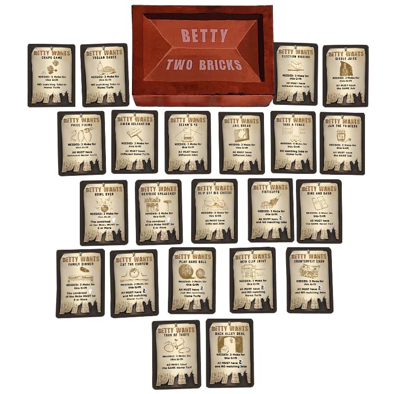 22 Grift Cards from Roaring Twenties-themed party card game Betty Two Bricks arranged in rows around the brick shaped game box.