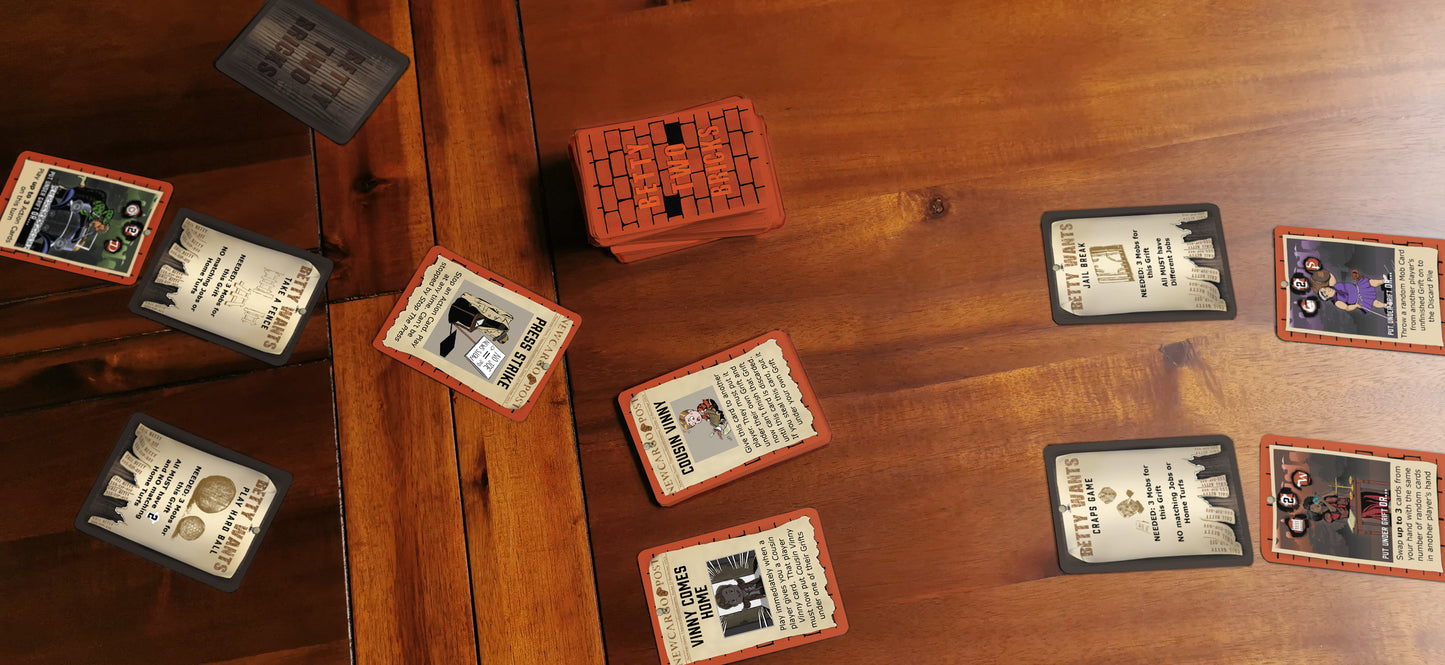 Cards from family tabletop game Betty Two Bricks in situ on a wooden table.
