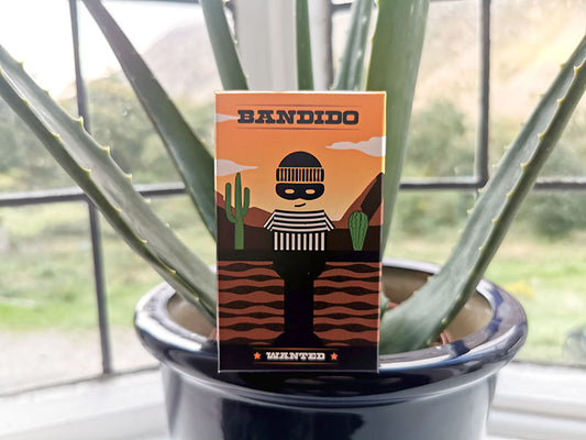 Bandida card game box on potted plant
