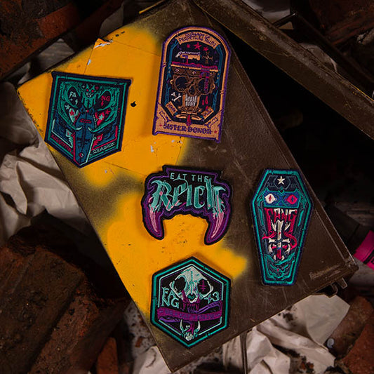 Image of Eat the Reich: Cloth Patch Pack. These accessories for an RPG by Rowan, Rook & Decard is available at indie online boardgames and card games retailer Kaioss Games